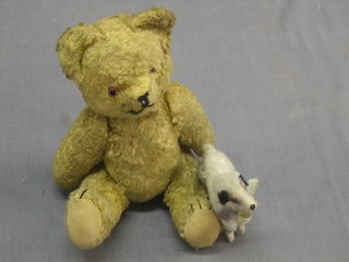 A yellow teddybear with articulated limbs 8" together with a small figure of a dog 3"