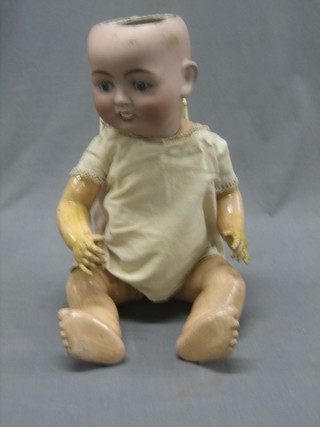 A porcelain doll with open eyes and open mouth with 2 teeth, the head incised CP208/60S Deponite