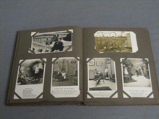 A brown album of various postcards