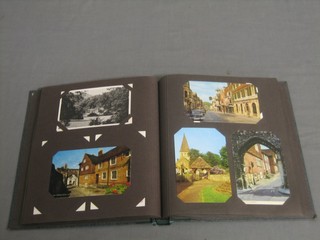 A green album of various postcards