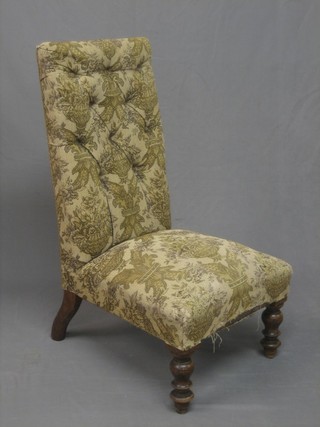 A Victorian mahogany framed nursing chair upholstered in tapestry material