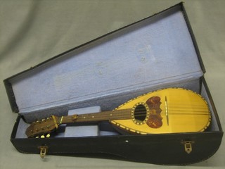 An 8 stringed mandolin labelled Alfredo Albertini Catania complete with carrying case