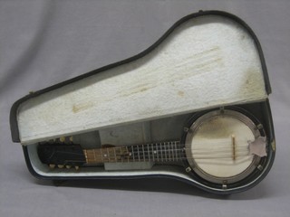 An 8 stringed banjo with 7 1/2" drum contained in a fibre case
