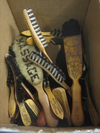 A collection of various old clothes brushes
