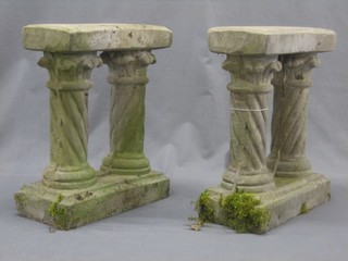 A good well weathered stoneware garden bench supported by 4 columns