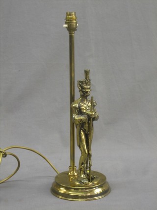 A gilt metal table lamp decorated a standing Napoleonic soldier 13"
