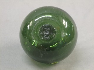 A 19th Century green glass fishing float marked RGF 4"