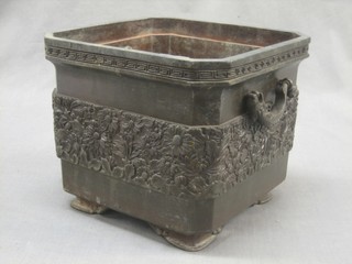 A 19th Century square Japanese bronze twin handled planter with Grecian key decoration, the body cast chrysanthemums, raised on bracket feet 9"