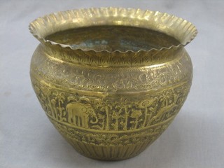 An Eastern embossed brass jardiniere decorated owls 8"