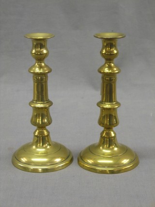 A pair of 19th Century brass candlesticks with ejectors 8 1/2"