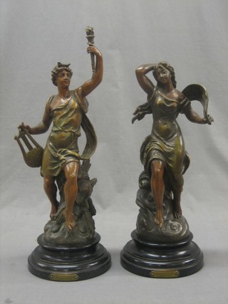 A pair of 19th Century Continental spelter figures in the form of a lady and gentleman, raised on socle bases 14"