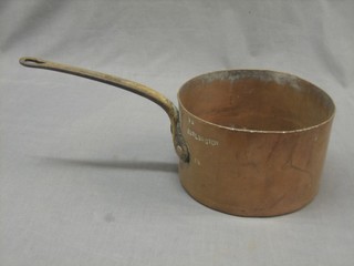 A large copper saucepan marked Burlington 8 1/4 with iron handle