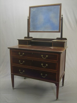 An Edwardian inlaid mahogany dressing chest with rectangular plate mirror above 2 glove boxes with hinged lid, the base fitted 3 long graduated drawers, raised on square tapering supports 36"