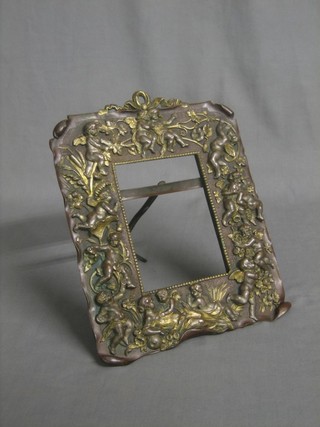 An embossed metal easel photograph frame decorated cherubs 9"