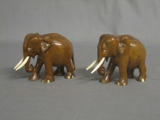A pair of Eastern carved figures of elephants 4"