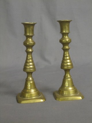 A pair of 19th Century brass candlesticks with knopped stems 7"