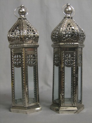 A pair of Eastern style octagonal pressed metal lanterns 14"