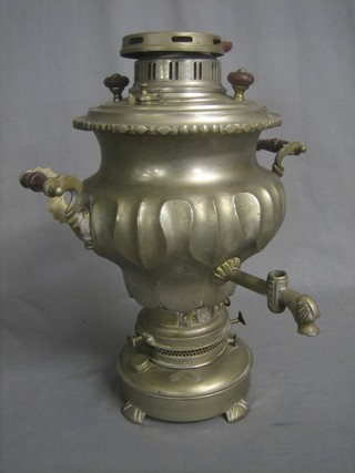 A metal twin handled Samovar