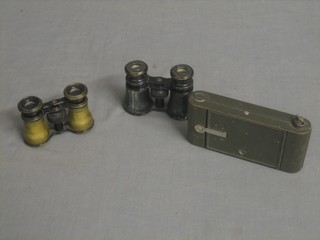 An Ensign folding greyhound camera and 2 pairs of opera glasses