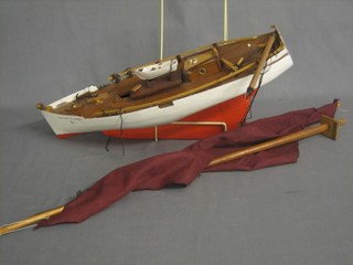 A wooden model of a yacht  19"