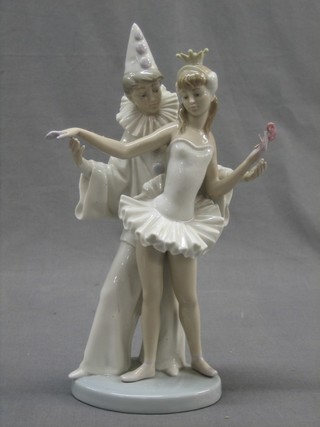 A Lladro figure of Pierrot dancing with a girl, base marked JU24N 10"