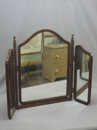 A mahogany triple plate dressing table mirror contained in a mahogany swing frame