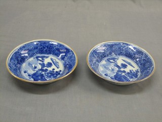 A pair of Oriental blue and white dishes decorated a boat with figures 7 1/2"