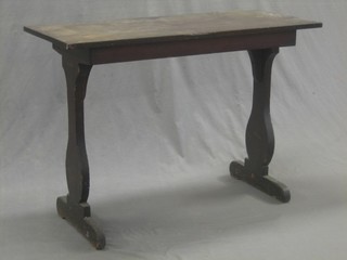A 19th Century rectangular mahogany side table, raised on standard end supports 40"