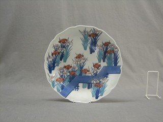 An Oriental porcelain plate with floral decoration, the reverse with 3 character mark 12"