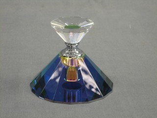 A faceted and waisted shaped coloured glass scent bottle and stopper of cylindrical form 4"