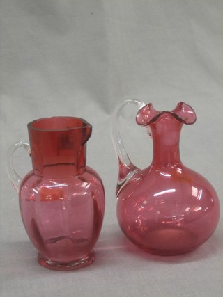 A Victorian cranberry glass jug with clear glass handle (some chips) 4 1/2" and 1 other