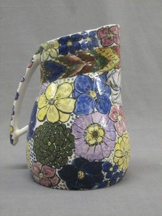 A 1930's pottery jug with floral decoration, the base impressed Goff L Shepherd, hand painted 1939 9"