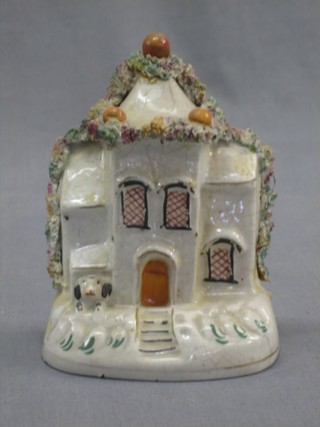 A Staffordshire money box in the form of a cottage (f and r) 6"