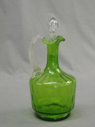 An Edwardian green glass ewer with clear glass handle 9"