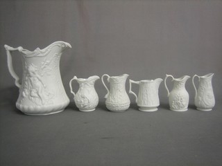 A Port Meirion pottery jug decorated cherubs 9" and 5 other various pottery jugs
