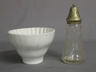 A cut glass sugar sifter with plated mount 7", together with a white glazed jelly mould 6"