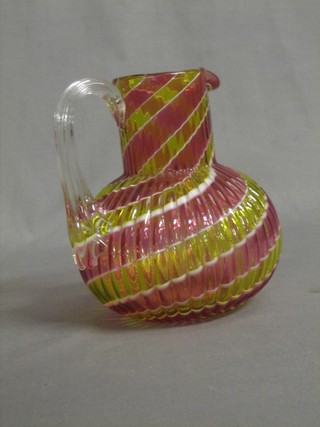 A Victorian striped glass jug with clear glass handle 6"