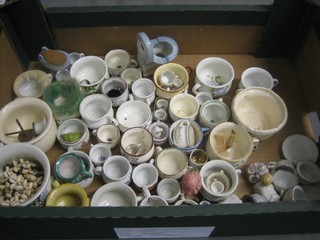A collection of miniature chamber pots