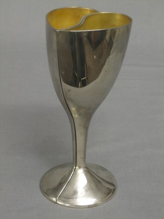 A heart shaped silver plated goblet in the form of 2 hearts