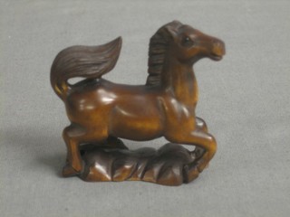 A modern wooden Netsuke in the form of a horse 2"