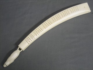 A carved ivory cribbage board 12"
