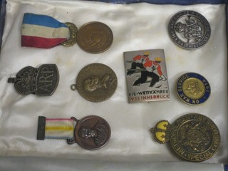 A Metropolitan Special Constabulary lapel badge, a service badge 1914, 2 bronze medals decorated Lord Roberts, a French bronze commemorative medal, a WWI discharge badge, an ARP badge and a French enamelled ski badge marked Fis-Wettkampfe 1933 Innsbruck