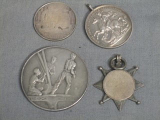 A French "silver" medallion to commemorative The Eiffel Tower, a silver Army Temperance Association medal, a silver 1924 British Empire medal, a silver watch chain medal