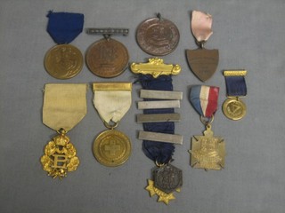 A WWI Red Cross medal, a bronze Bryant & May Long Service medal, a Gas Light and Coke Company Centenary medal, a Primrose leaf medal and 6 other bronze medals
