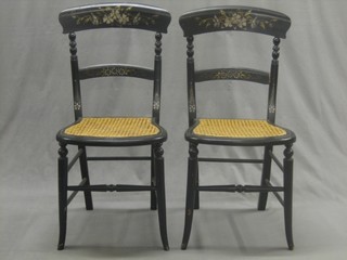 A pair of Victorian ebonised and painted bar back bedroom chairs with woven cane seats, raised on turned supports (1f)