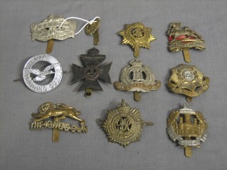 A Kings Royal Rifle Corps cap badge, a Gloucester Regt. back and front cap badge and 8 other cap badges