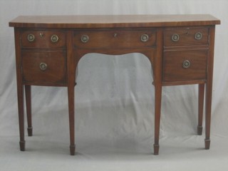 A Georgian style mahogany bow front sideboard fitted 1 long drawer flanked by a pair of cupboards, raised on square tapering supports and ending in spade feet 54"