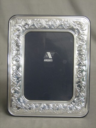 A modern embossed silver easel photograph frame 10" x 8"