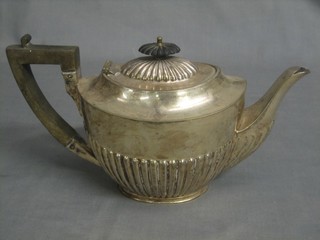 An oval silver plated teapot with demi-reeded decoration by James Dixon