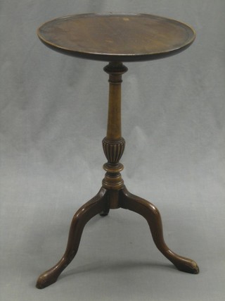 A circular turned mahogany wine table, raised on pillar and tripod supports 15" (leg f and r)
